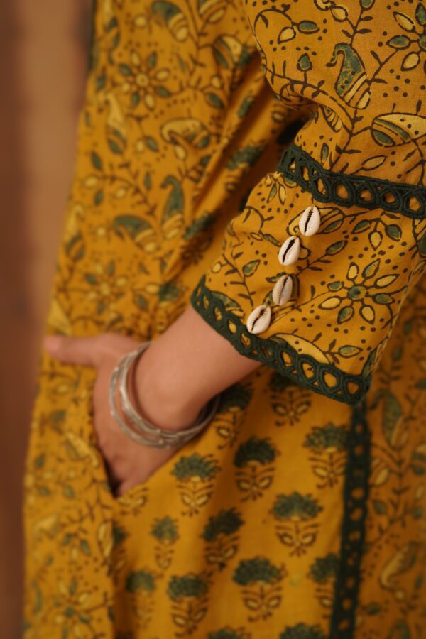 Mustard Yellow Ajrakh A-Line Kurta with cowrie shells and crochet lace detailing in cotton fabric - Image 6